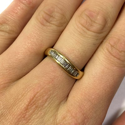 Lot 126 - An 18ct gold diamond half eternity ring