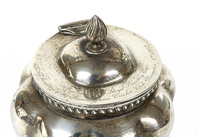 Lot 24 - An oval, lobed, silver tea caddy