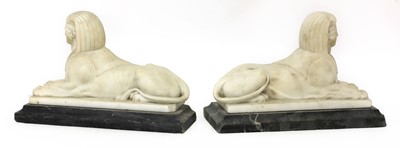 Lot 860 - A pair of carved marble sphinx
