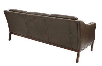 Lot 365 - A Danish brown leather three-seater sofa