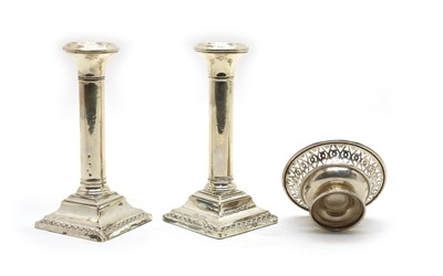Lot 77 - A pair of silver candlesticks