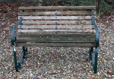 Lot 411 - Teak and wrought iron garden bench