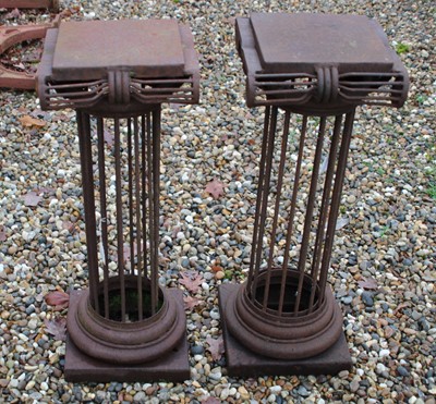 Lot 684 - A pair of wrought iron column form stands of classical design