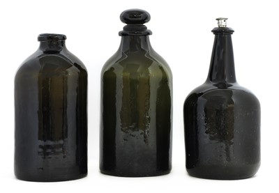 Lot 752 - A large cylindrical sealed green glass wine bottle