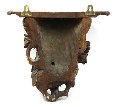 Lot 73 - A Black Forest carved softwood wall bracket
