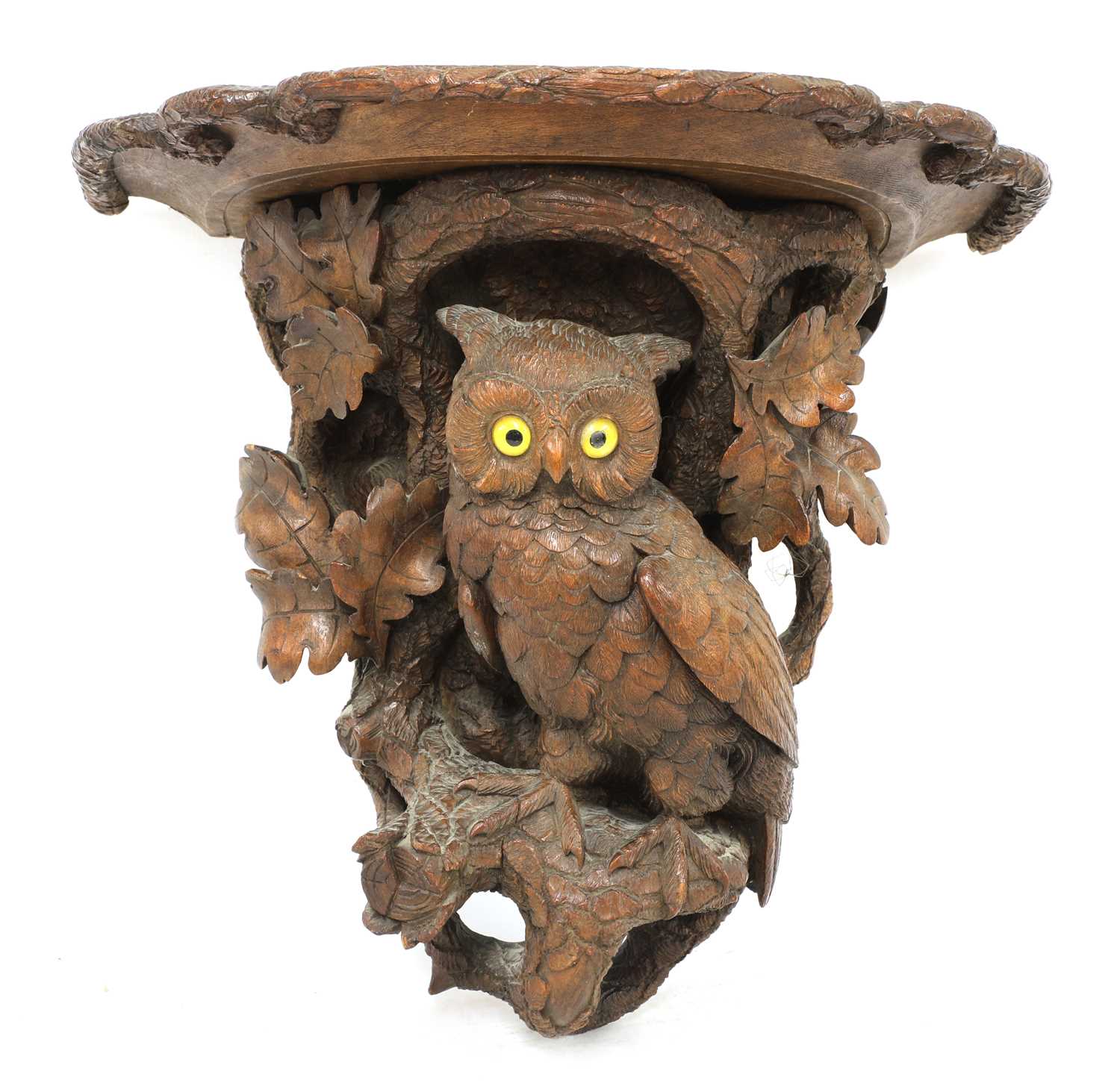 Lot 73 - A Black Forest carved softwood wall bracket