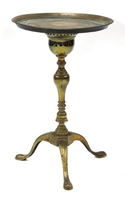 Lot 111 - A George II brass kettle stand