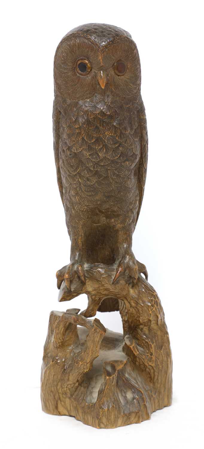 Lot 72 - A Black Forest carved softwood owl