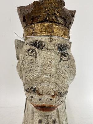 Lot 126 - A carved and painted oak armorial leopard head