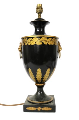 Lot 106 - A black toleware table lamp