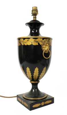 Lot 106 - A black toleware table lamp