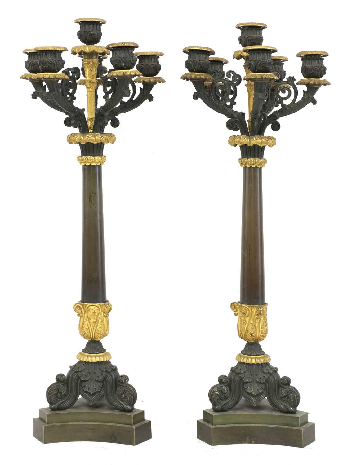 Lot 32 - A pair of French Empire bronze and parcel gilt candelabrum