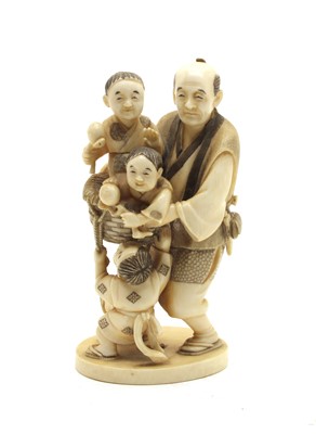 Lot 277 - A small late 19th century Japanese carved sectional ivory group of a father and his children