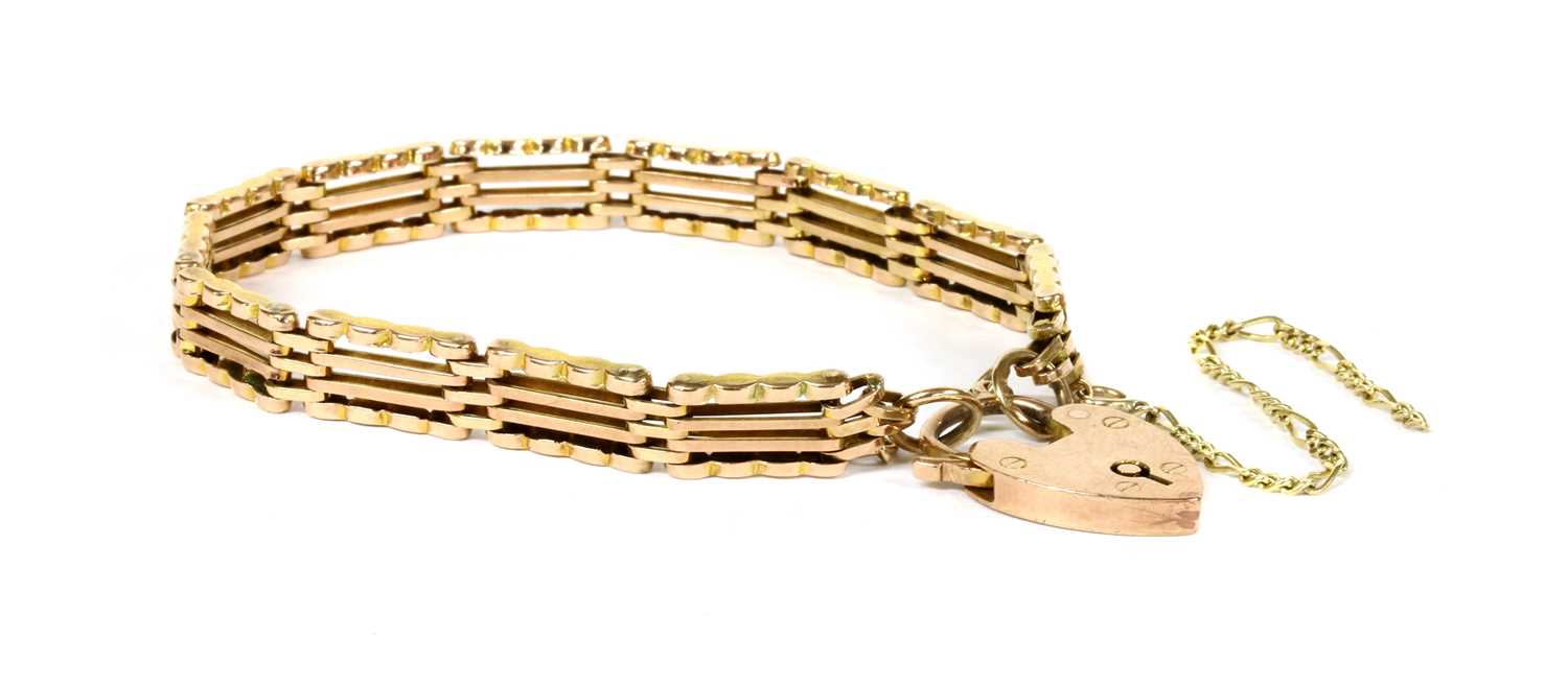 Lot 72 - A gold four row gate bracelet