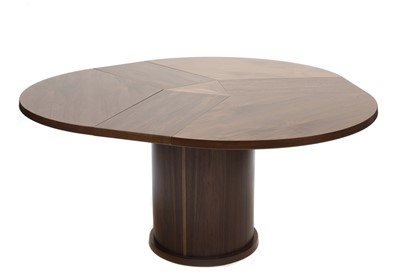 Lot 227 - A Skovby 'Confide' walnut veneered extending circular dining table
