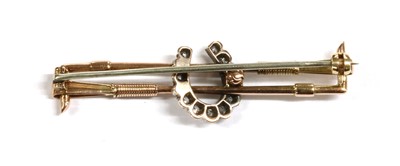 Lot 15 - A gold and silver diamond set horseshoe bar brooch