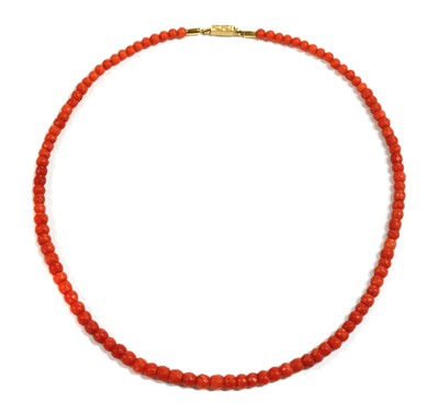 Lot 35 - A single row graduated faceted coral bead necklace