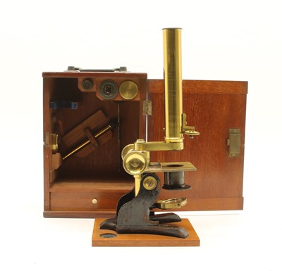 Lot 247 - A mahogany cased microscope
