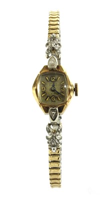 Lot 267 - A ladies' gold diamond set mechanical bracelet watch