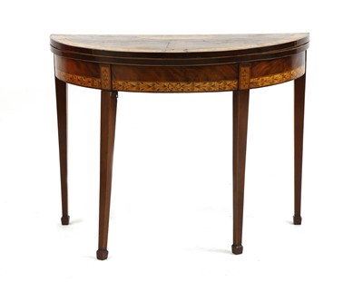 Lot 656 - A George III mahogany satinwood demilune foldover card table