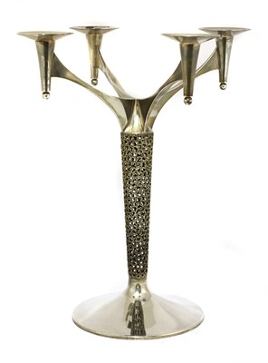 Lot 409 - A silver-gilt four branch candelabra