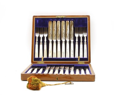 Lot 60 - A set of twelve silver mounted and mother of pearl handled dessert knives and forks