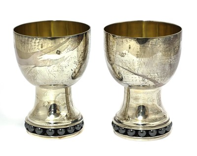 Lot 413 - A contemporary silver wine jug and two goblets