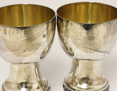 Lot 413 - A contemporary silver wine jug and two goblets