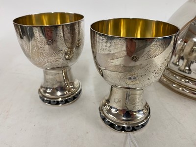 Lot 413 - A contemporary silver wine jug and two goblets