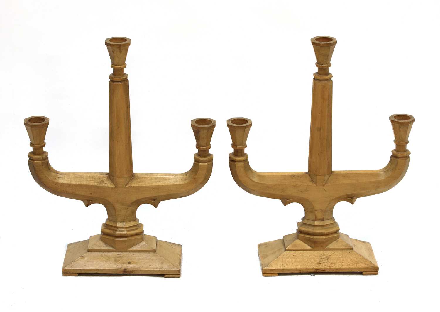 Lot 98 - A pair of fruitwood three-branch candelabra