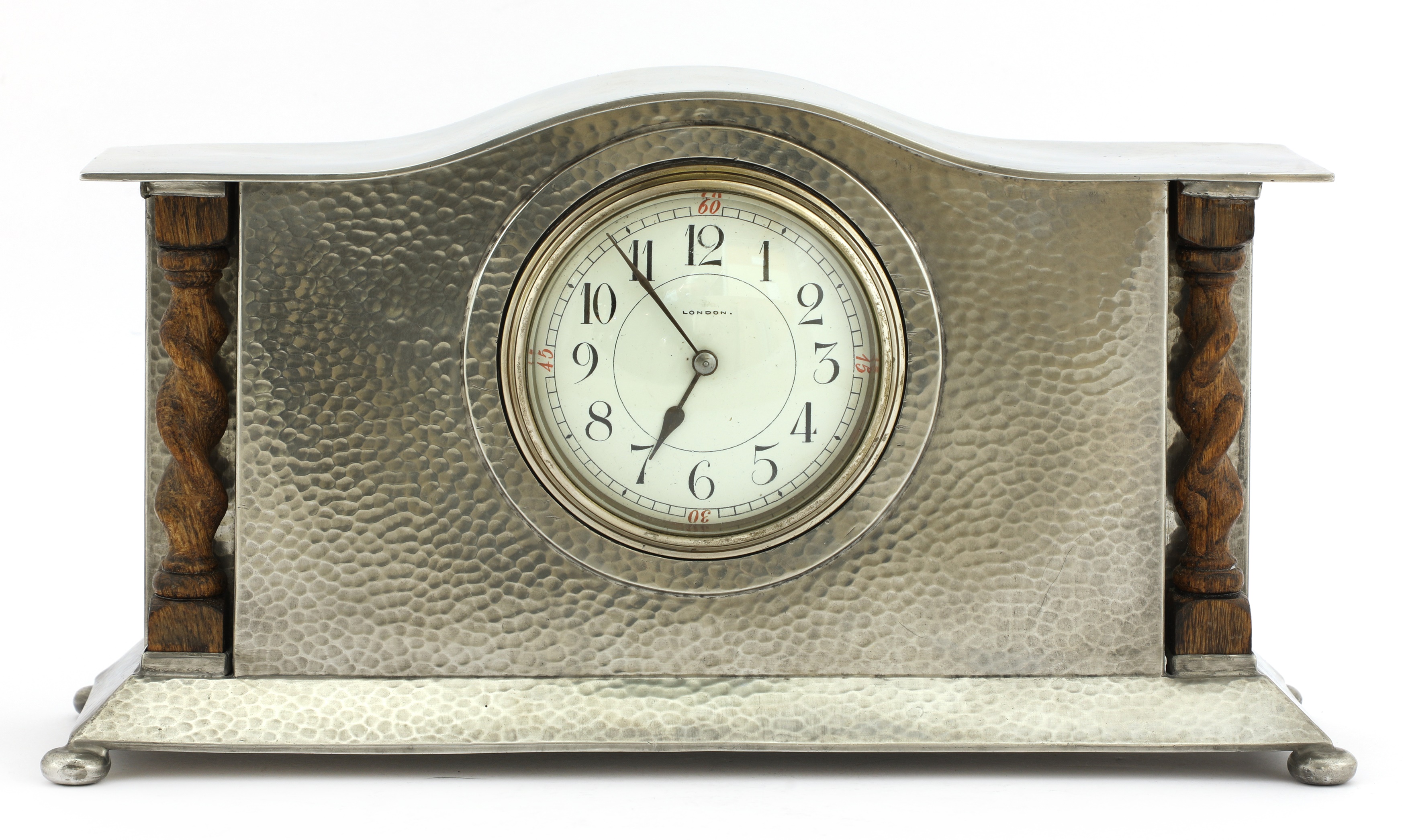 Lot 61 A Liberty Tudric pewter mantel clock,