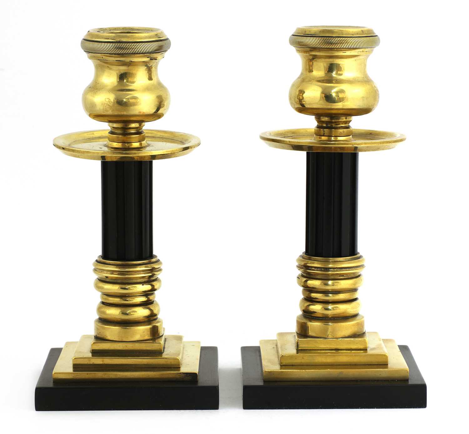 Lot 115 - A pair of bronze and Bakelite candlesticks