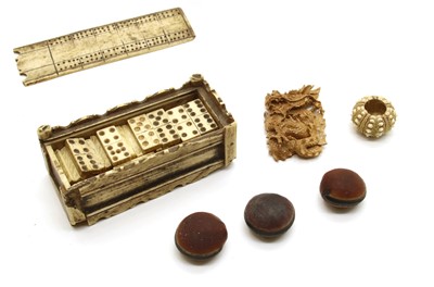 Lot 78 - A Napoleonic prisoner of war carved bone domino 'sevens' set (incomplete) in box