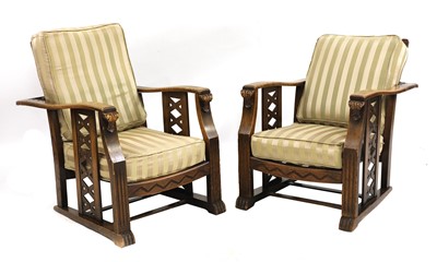 Lot 114 - A pair of Art Deco oak reclining armchairs