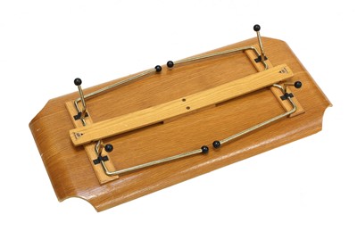 Lot 447 - A laminated oak veneered bed tray table