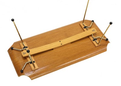 Lot 447 - A laminated oak veneered bed tray table