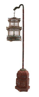 Lot 302 - A Chinese circular wooden birdcage on stand