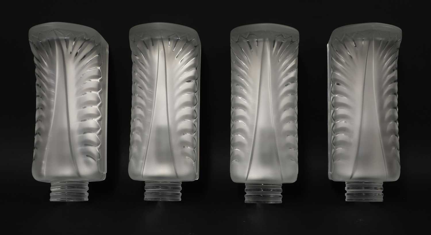 Lot 217 - A set of four Lalique 'Palme' glass wall lights