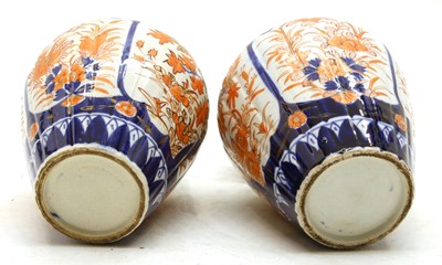 Lot 171 - A pair of Japanese imari lidded vases
