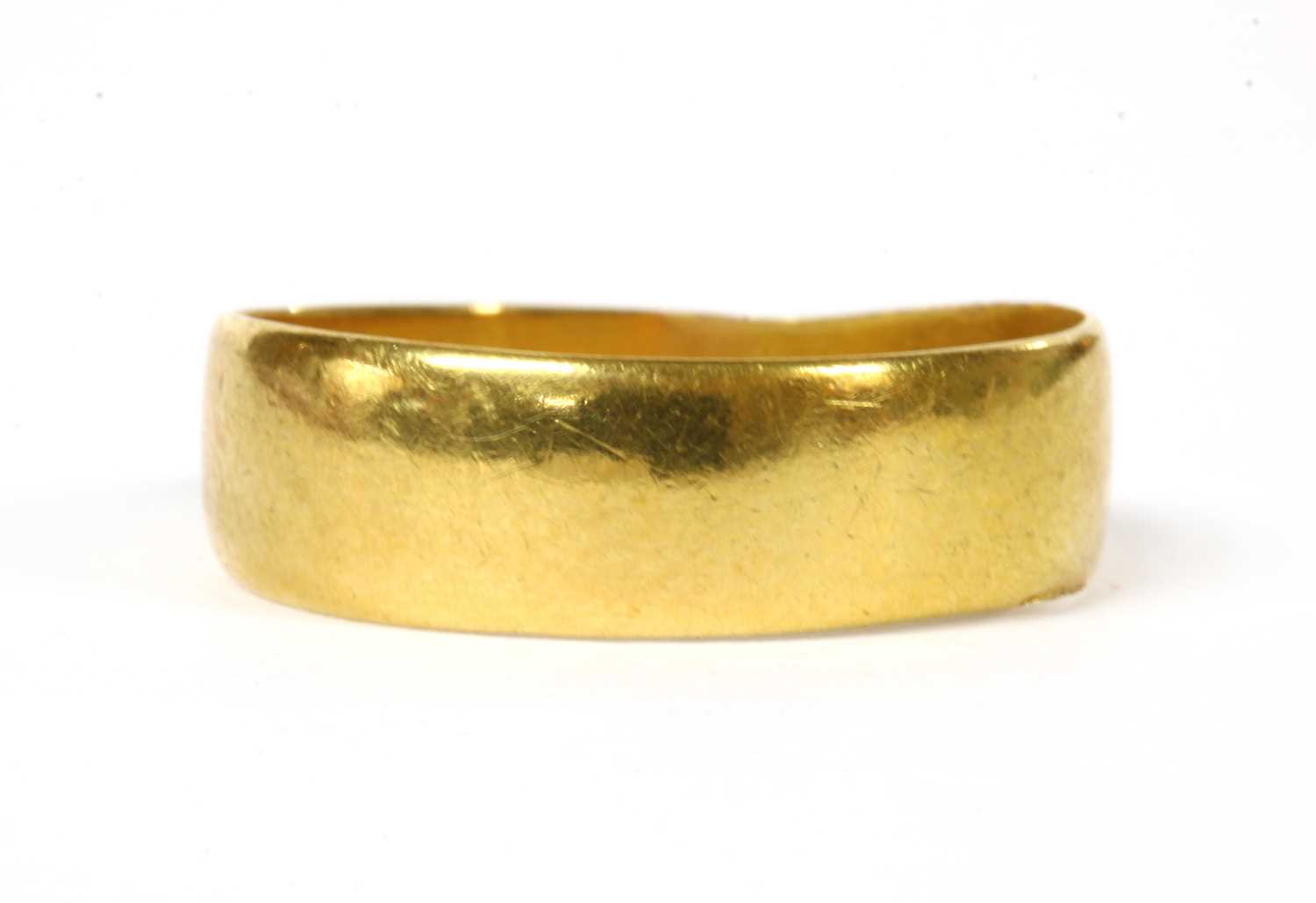 Lot 56 - A 22ct gold flat section wedding ring