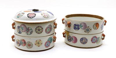 Lot 212 - A Chinese famille rose porcelain four stack food container