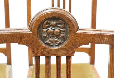 Lot 23 - A set of six oak dining chairs