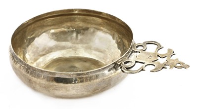Lot 800 - A Charles II silver bleeding bowl