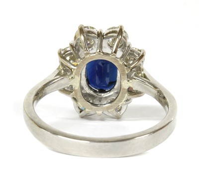 Lot 106 - A platinum sapphire and diamond cluster ring
