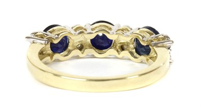 Lot 147 - A gold eleven stone sapphire and diamond ring