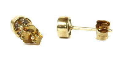 Lot 137 - A pair of gold diamond cluster earrings