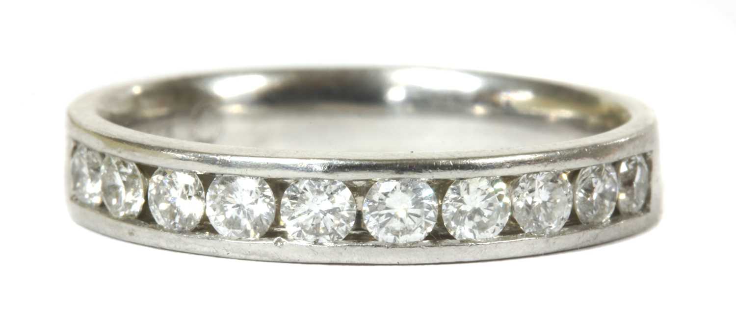 Lot 82 - A white gold diamond half eternity ring