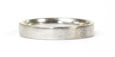 Lot 82 - A white gold diamond half eternity ring