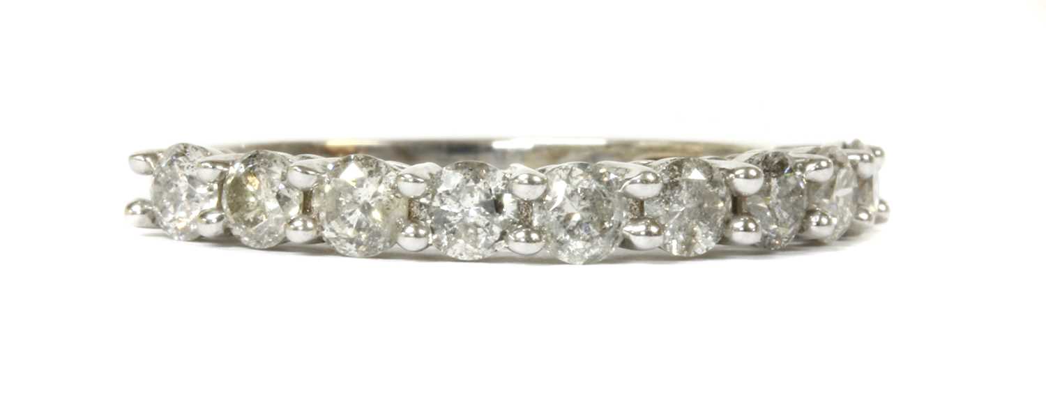 Lot 98 - A white gold diamond half eternity ring