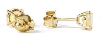 Lot 330 - A pair of gold single stone opal stud earrings